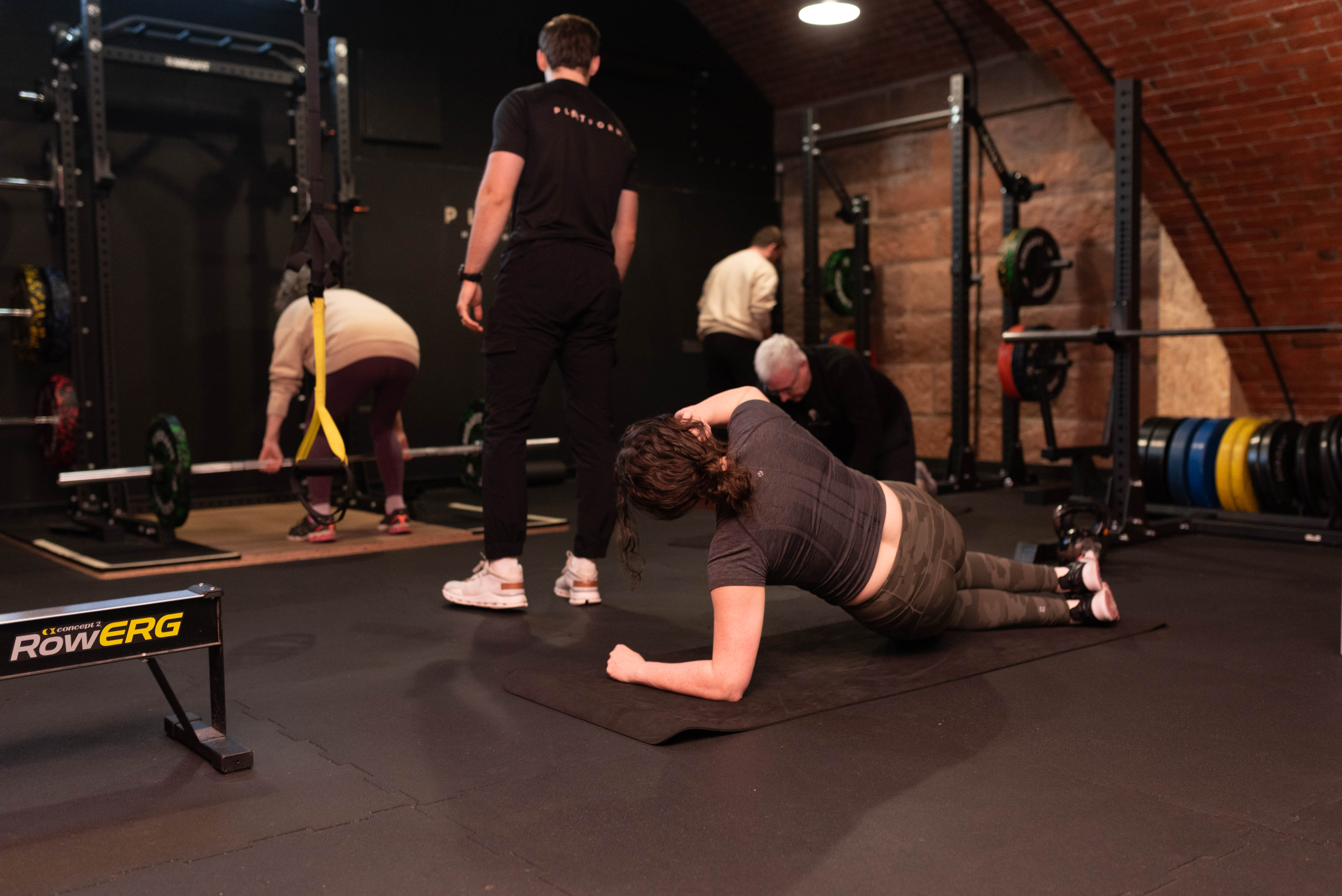 Personal trainer coaching a group session at Platform Health and Fitness, showing the client base a new PT in Edinburgh needs to quit their job